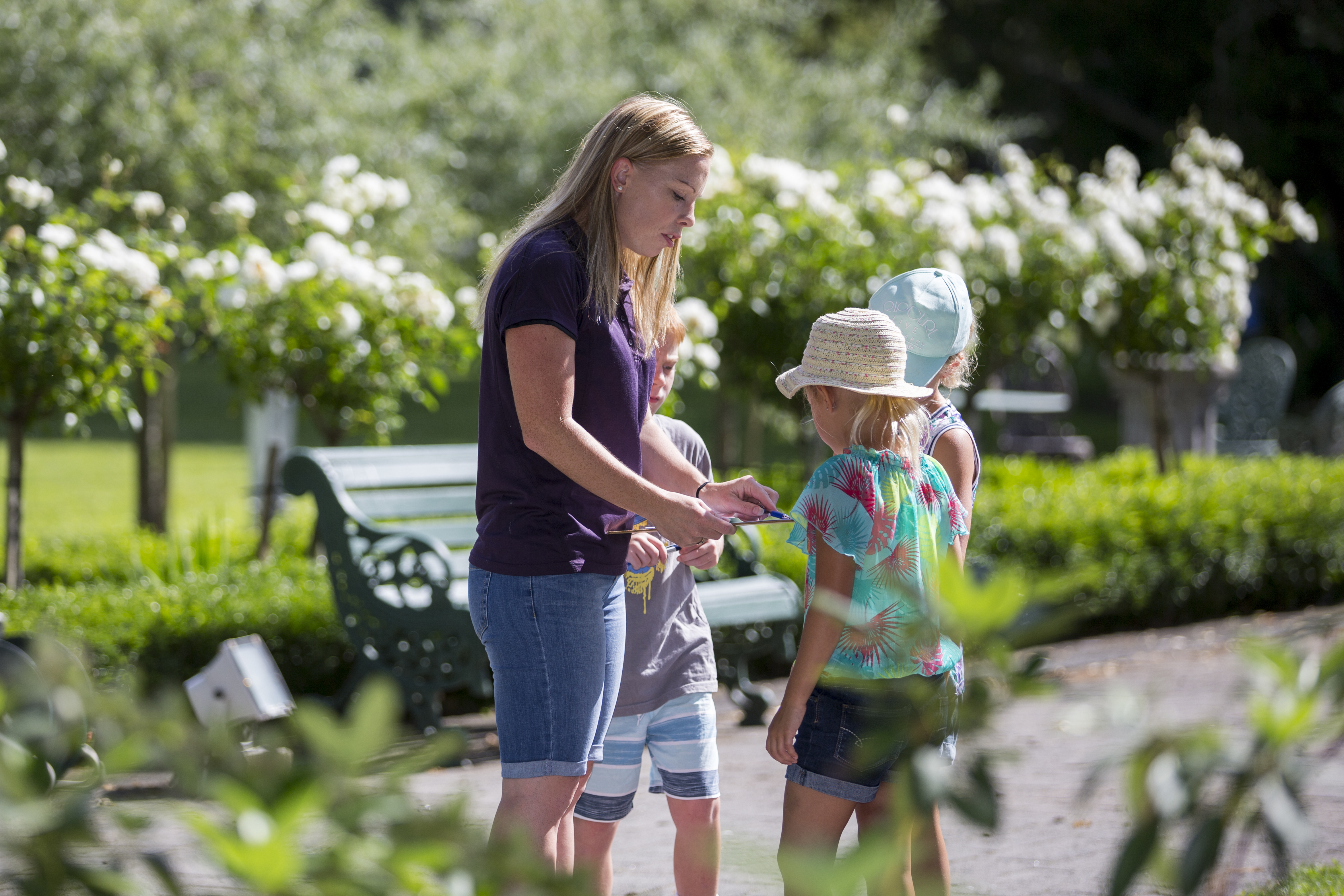 Mum and children looking at a map